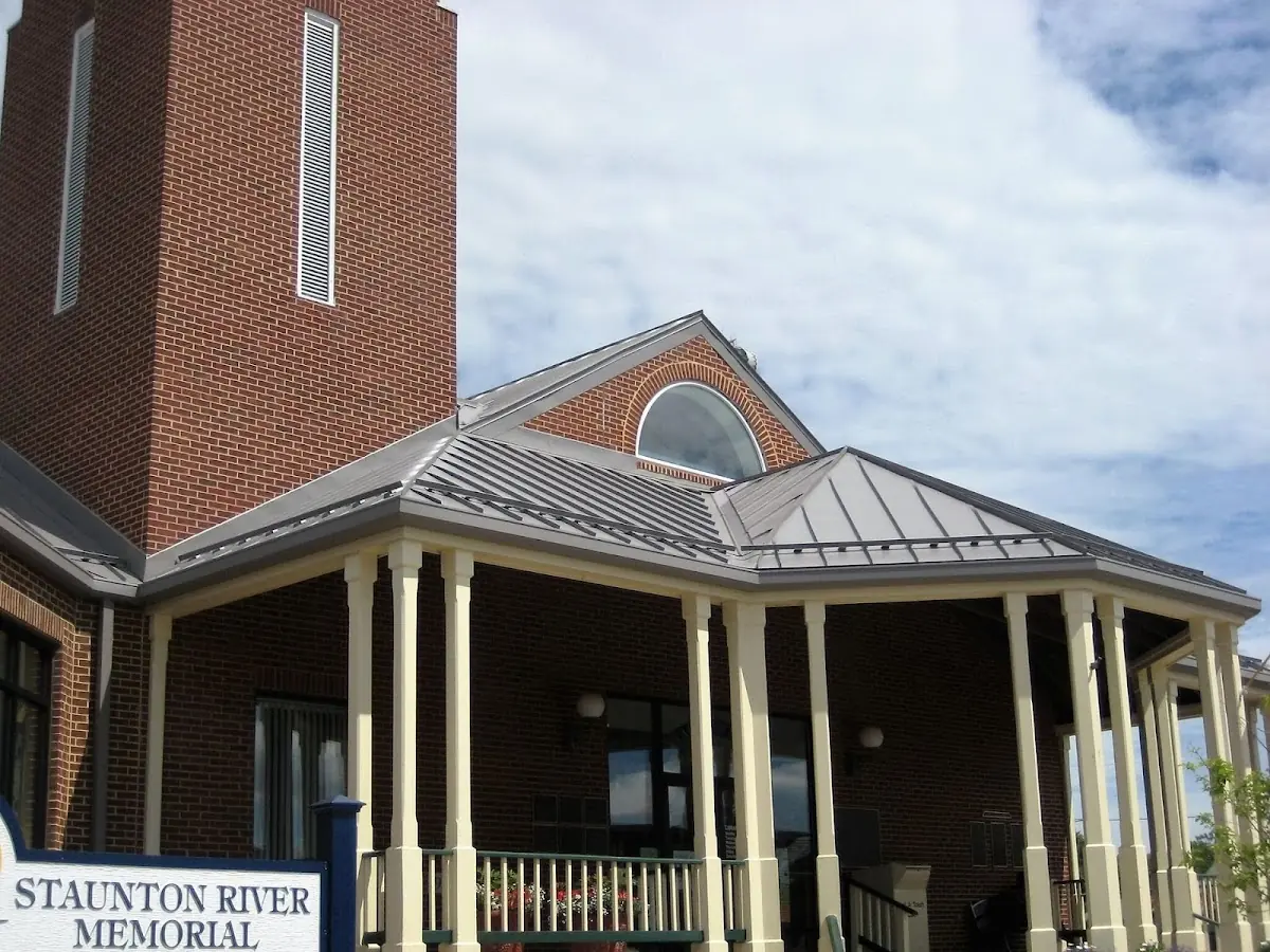 Skilled roofing craftsmen working on a residential roof in Laurens